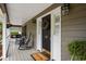 Inviting front porch with rocking chairs and 'Welcome' mat at 40 Capt Anthony White Ln., Georgetown, SC 29440