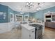 Open kitchen layout with stainless steel oven, island cooktop and view to outdoor space at 40 Capt Anthony White Ln., Georgetown, SC 29440