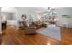 Open-concept living room featuring hardwood floors and comfortable leather seating at 40 Capt Anthony White Ln., Georgetown, SC 29440