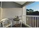 Balcony with two chairs and a small table at 401 N Hillside Dr. # 3C, North Myrtle Beach, SC 29582