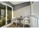 Private balcony with small table and two chairs at 401 N Hillside Dr. # 3C, North Myrtle Beach, SC 29582