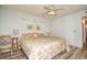 Bedroom with king-size bed, ceiling fan, and wood flooring at 401 N Hillside Dr. # 3C, North Myrtle Beach, SC 29582