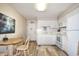 Cozy kitchen with white cabinets, and a dining area at 401 N Hillside Dr. # 3C, North Myrtle Beach, SC 29582