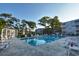 Refreshing community pool with surrounding lounge chairs at 401 N Hillside Dr. # 3C, North Myrtle Beach, SC 29582