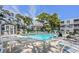 Community pool with residents enjoying a sunny day at 401 N Hillside Dr. # 3C, North Myrtle Beach, SC 29582