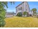 Gray house exterior with a spacious yard and shed at 404 29Th Ave. N, North Myrtle Beach, SC 29582