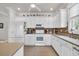 Modern kitchen with white cabinets and tile flooring at 421 Huntington Lake Circle # 82, Pawleys Island, SC 29585