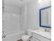 Clean bathroom with a shower/tub combo, toilet, vanity, and blue framed mirror at 4348 Livorn Loop # 4348, Myrtle Beach, SC 29579
