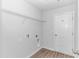 Laundry room with vinyl flooring, shelving, and hookups for a washer and dryer at 4348 Livorn Loop # 4348, Myrtle Beach, SC 29579