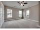 Bright bedroom with carpet, multiple windows, and ceiling fan at 4417 N Plantation Harbour Dr. # B, Little River, SC 29566