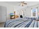 Bright bedroom with two twin beds, a TV, and ample natural light at 4533 Girvan Dr. # D, Myrtle Beach, SC 29579