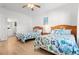 Guest bedroom with twin beds, dresser, and access to bathroom at 4533 Girvan Dr. # D, Myrtle Beach, SC 29579