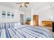 Bright bedroom with two twin beds, dresser, and large window at 4533 Girvan Dr. # D, Myrtle Beach, SC 29579