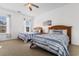 Well-lit bedroom featuring two twin beds with striped bedding and natural light at 4533 Girvan Dr. # D, Myrtle Beach, SC 29579