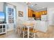 Bright dining area with white table and chairs, near the kitchen at 4533 Girvan Dr. # D, Myrtle Beach, SC 29579