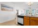 Kitchen with wood cabinets, white appliances, and a peninsula at 4533 Girvan Dr. # D, Myrtle Beach, SC 29579