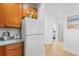 White appliances and wood cabinets highlight this kitchen at 4533 Girvan Dr. # D, Myrtle Beach, SC 29579