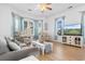 Living room boasts hardwood floors, ample seating, and a large TV at 4533 Girvan Dr. # D, Myrtle Beach, SC 29579