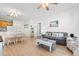 Bright living room features hardwood floors, comfy seating, and a large window at 4533 Girvan Dr. # D, Myrtle Beach, SC 29579