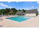 Community pool with lounge chairs and shaded seating areas at 4533 Girvan Dr. # D, Myrtle Beach, SC 29579