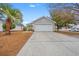 Gray house with white garage door and landscaping at 4600 Hidden Creek Ln., Myrtle Beach, SC 29579