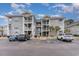 Front view of a multi-story condo building at 4761 Wild Iris Dr. # 103, Myrtle Beach, SC 29577