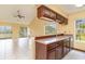 Kitchen with breakfast bar and wood cabinets at 4910 Windsor Green Way # 303, Myrtle Beach, SC 29579