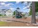 playground with modern equipment and wood chips at 4910 Windsor Green Way # 303, Myrtle Beach, SC 29579