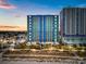 Aerial view of beachfront building at dusk at 504 N Ocean Blvd. # 1511, Myrtle Beach, SC 29577