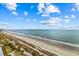 Oceanfront view of sandy beach with walkway and pier in the distance at 504 N Ocean Blvd. # 1511, Myrtle Beach, SC 29577