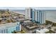 Wide aerial view of resort, beach, ocean, and surrounding buildings at 504 N Ocean Blvd. # 1511, Myrtle Beach, SC 29577