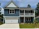 Charming two-story home with a welcoming front porch and a two car garage at 523 Slaty Dr., Myrtle Beach, SC 29588
