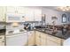 White kitchen cabinets, granite counters, and appliances at 562 Blue Stem Dr. # 54D, Pawleys Island, SC 29585