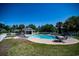 Community pool with lounge chairs and tables at 562 Blue Stem Dr. # 54D, Pawleys Island, SC 29585