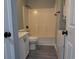 Bathroom with tub, toilet, vanity, and stackable washer/dryer at 573 Blue River Ct. # 8-H, Myrtle Beach, SC 29579