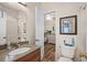 Clean bathroom with sink, toilet, and shower, plus a view into a bedroom at 6001 - B-4 S Kings Hwy., Myrtle Beach, SC 29575
