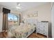 Ocean-view bedroom with a bed and dresser at 6001 - B-4 S Kings Hwy., Myrtle Beach, SC 29575