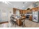 Kitchen boasts ample wood cabinetry, granite counters, and stainless steel appliances at 6001 - B-4 S Kings Hwy., Myrtle Beach, SC 29575