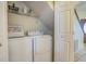 Well-lit laundry room, complete with washer, dryer, and shelving at 6001 - B-4 S Kings Hwy., Myrtle Beach, SC 29575