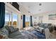 Oceanfront living room with comfy sofas and access to balcony at 6001 - B-4 S Kings Hwy., Myrtle Beach, SC 29575