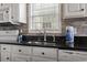 Modern kitchen features white cabinets, granite countertops, and stainless steel appliances at 6001-1108 South Kings Hwy., Myrtle Beach, SC 29575
