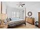 Serene bedroom with a wooden dresser and post bed at 6760 Ocean Breeze Loop, Myrtle Beach, SC 29572