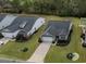 Aerial view of homes with manicured lawns and driveways in a quiet residential neighborhood at 688 Tattlesbury Dr., Conway, SC 29526