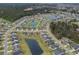 An aerial view of homes surrounding ponds and lush landscaping, highlighting the community's layout at 688 Tattlesbury Dr., Conway, SC 29526