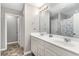 Bathroom with double sink vanity, tile floors, and a shower/tub combo at 688 Tattlesbury Dr., Conway, SC 29526