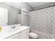 A bathroom with gray walls, a white vanity, a toilet, and a shower with a decorative curtain at 688 Tattlesbury Dr., Conway, SC 29526