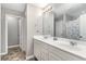 Double vanity bathroom with white cabinets and a shower/tub combo at 688 Tattlesbury Dr., Conway, SC 29526