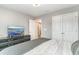 A simple bedroom with gray walls, a flatscreen TV on a dresser, and a comfortable bed at 688 Tattlesbury Dr., Conway, SC 29526
