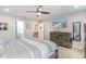 Bedroom with wood-look floors, dresser, ceiling fan, and a wall-mounted television at 688 Tattlesbury Dr., Conway, SC 29526