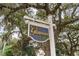 Glenmoor neighborhood sign featuring decorative accents and lush surrounding trees at 688 Tattlesbury Dr., Conway, SC 29526